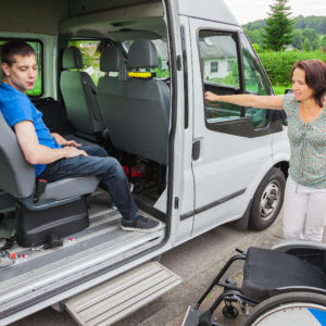 Disabled boy being picked up by school bus