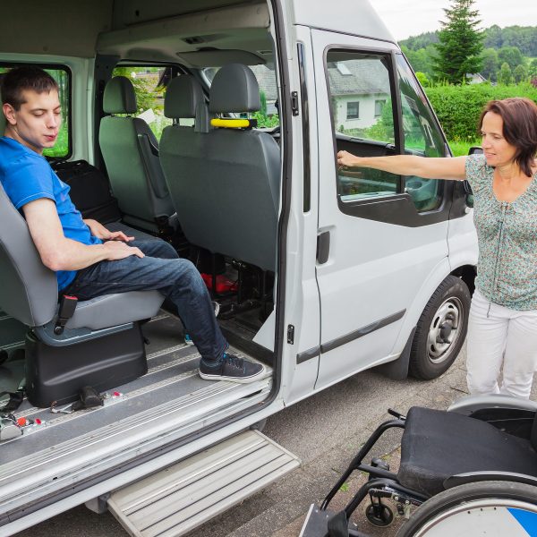 Disabled boy being picked up by school bus