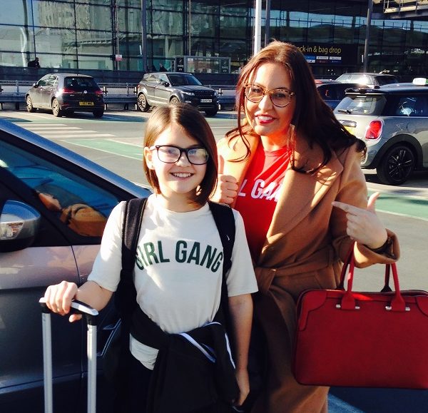 Carly and her daughter at the airport