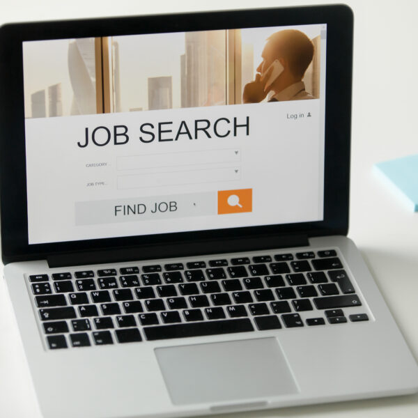 open laptop with job search