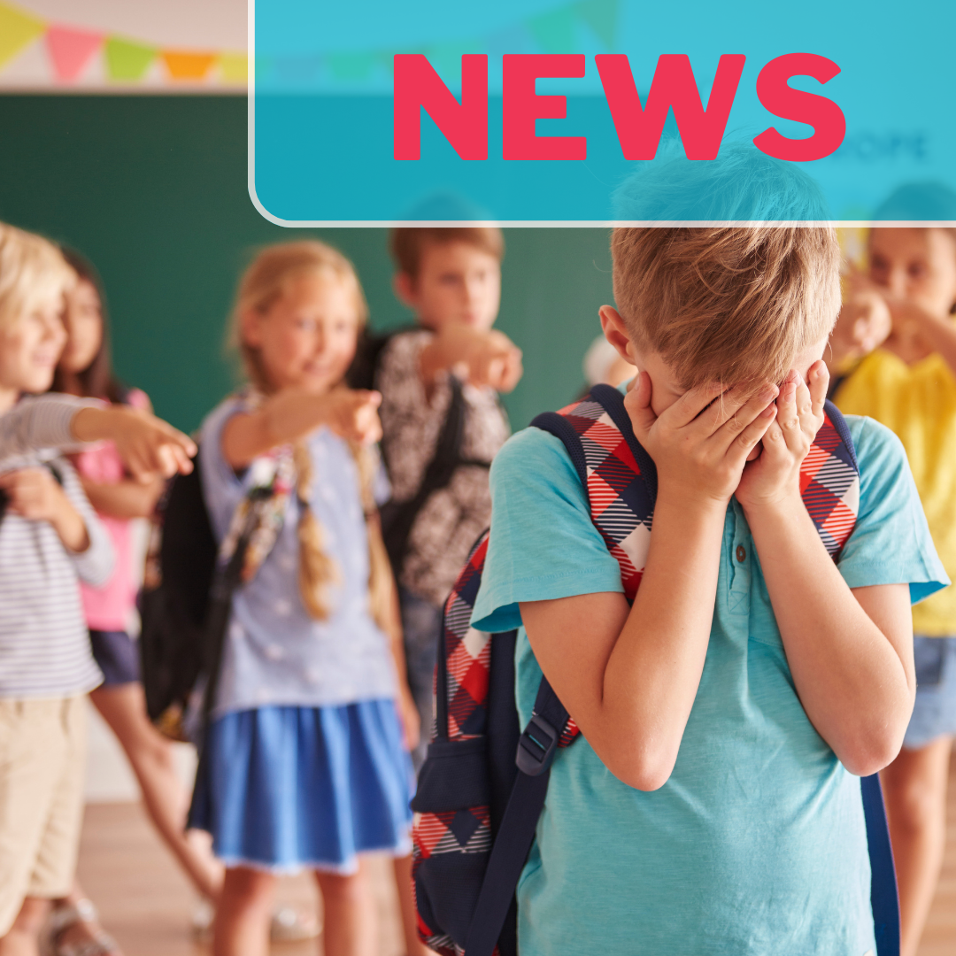 A boy is crying in the forefront of the photo as a group of children point and laugh at him